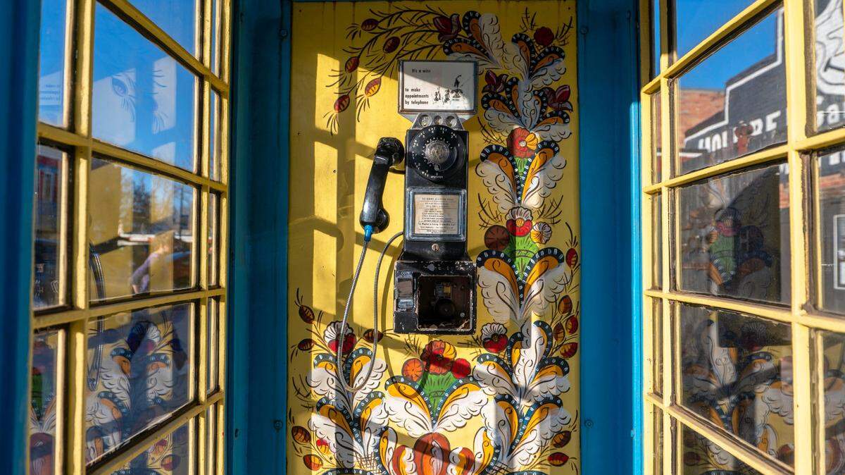A Swedish themed telephone booth called “Tala Dala,” is displayed in front of Blacksmith Coffee Shop on Saturday, Dec. 10, 2022, in Lindsborg, Kansas.