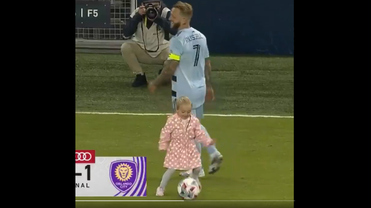 Blake Russell, foreground, dribbles the ball away after dispossessing her dad, Sporting KC captain Johnny Russell, following a recent MLS game at Children’s Mercy Park.