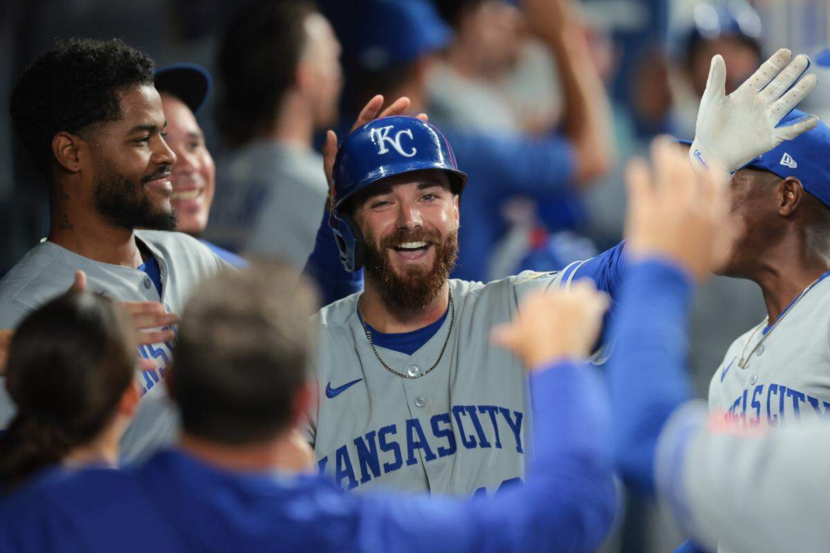 Kansas City Royals left fielder John Rave celebrates with teammates after hitting his first major-league home run, a three-run shot, against the Marlins at LoanDepot Park in Miami on Friday, July 18, 2025.