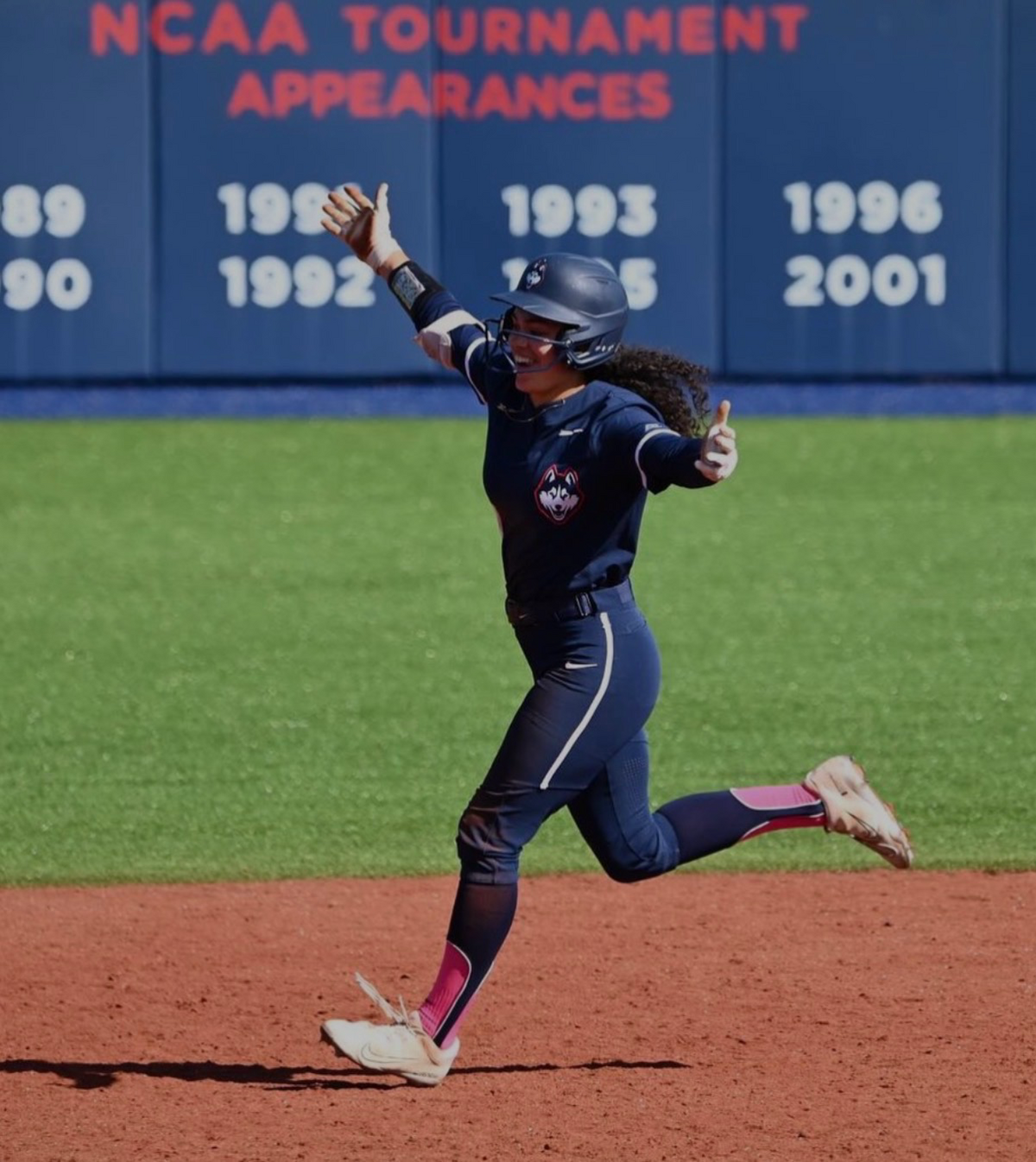 Lexi Hastings celebrates a home run during her time as a college softball player at UConn.