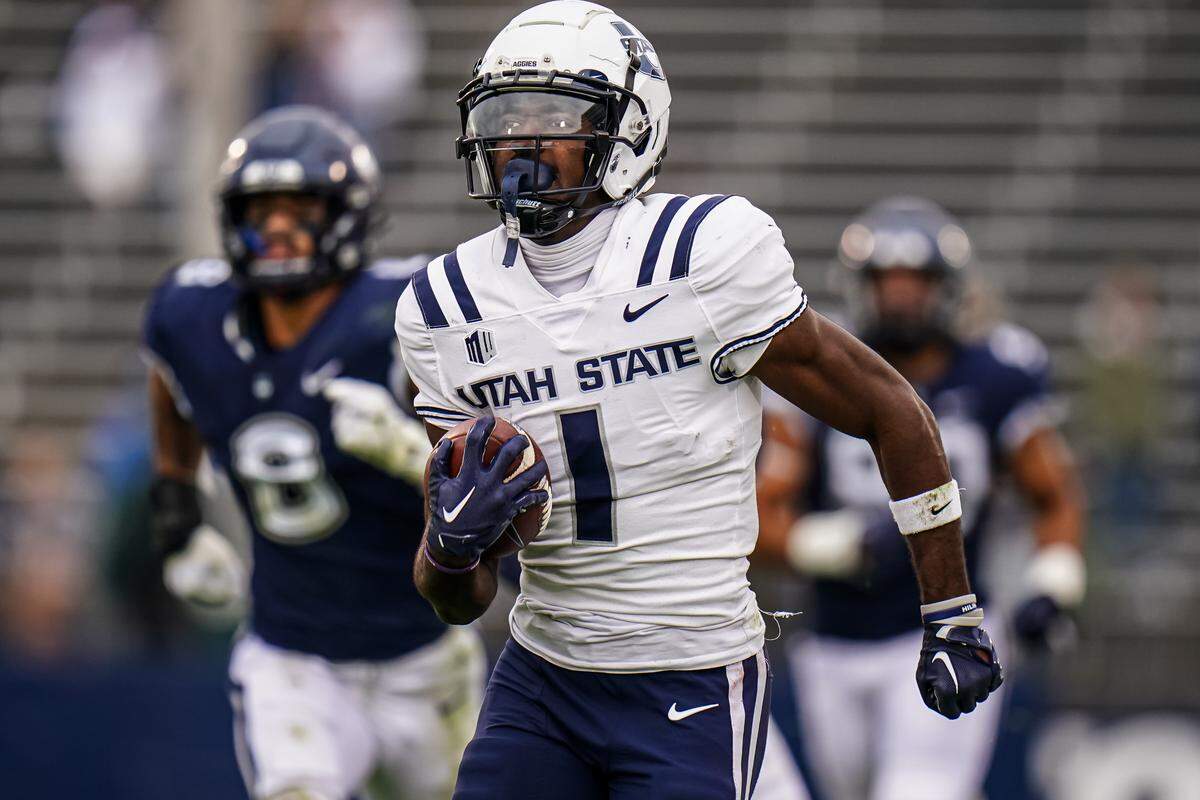 Utah State Aggies wide receiver Jalen Royals (1) runs in for a touchdown against the UConn Huskies in the second half at Rentschler Field at Pratt & Whitney Stadium on Sept. 30, 2023.