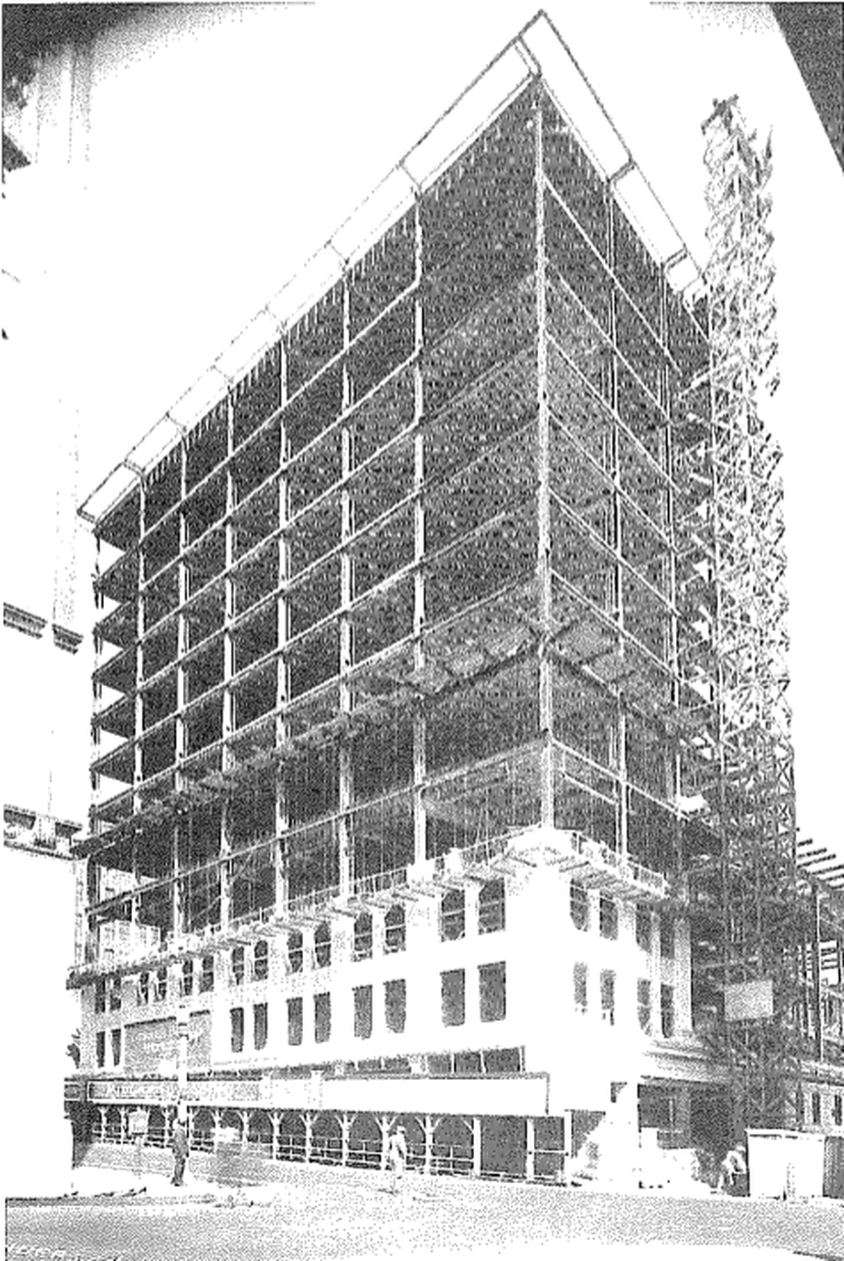 A 1920s photograph shows the construction of what is now Midland Lofts. The former office building is connected to the Midland Theater.