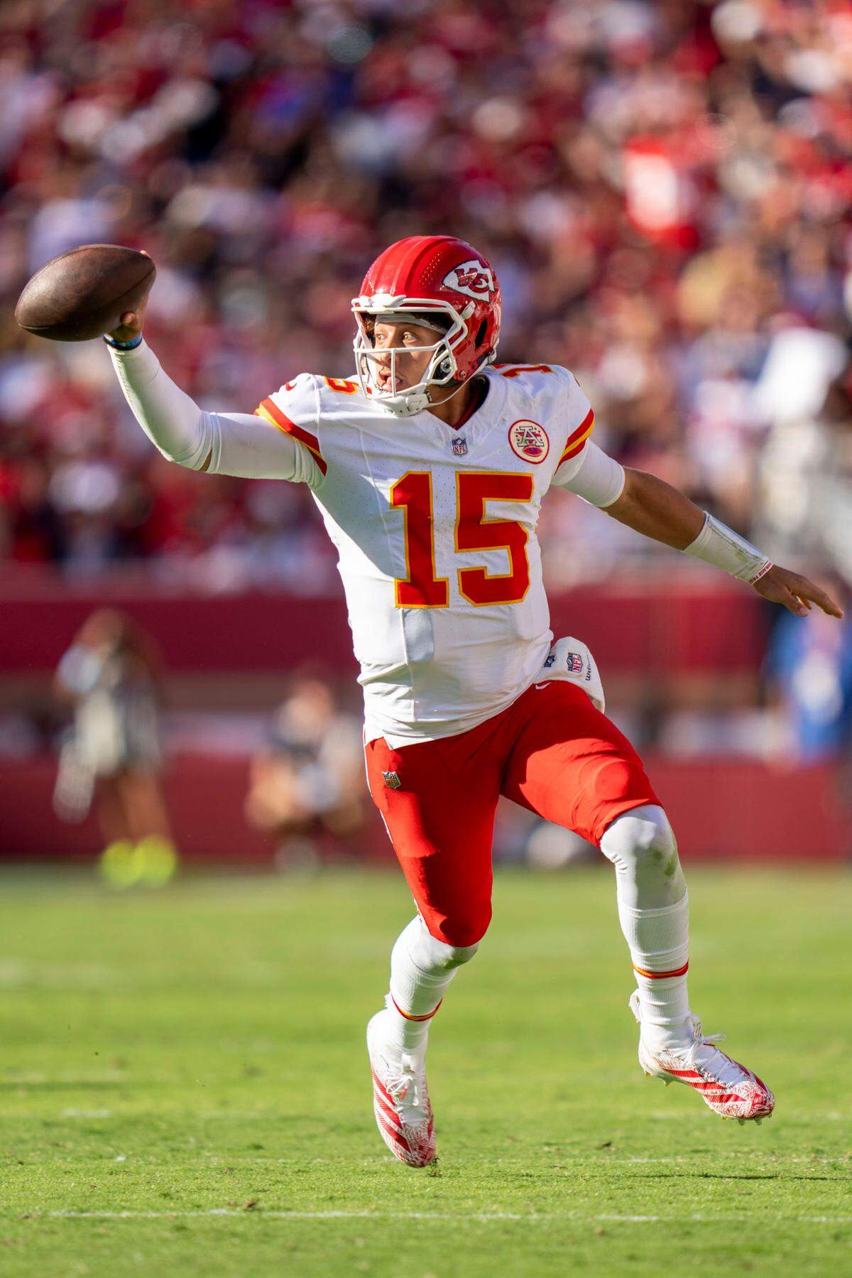 Kansas City Chiefs quarterback Patrick Mahomes (15) runs the football against the San Francisco 49ers during the third quarter at Levi’s Stadium.