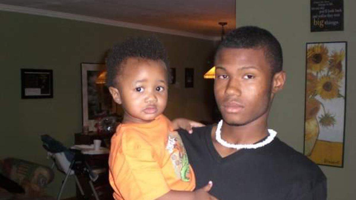 Giulian Williams, left, is pictured in July 2009 with his brother, Toriano Porter II. Months later, when Giulian was about 16 months old, Toriano II was fatally shot in north St. Louis at age 16.