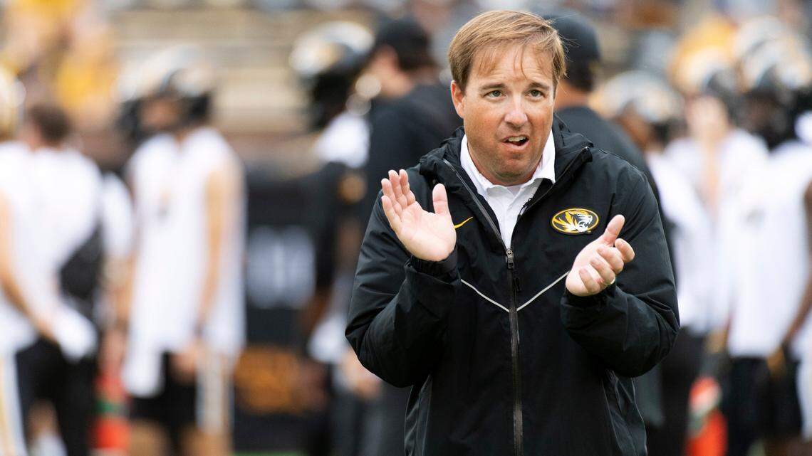 Missouri head coach Eliah Drinkwitz watches his team warm up before the start of an NCAA college football game against Tennessee Saturday, Oct. 2, 2021, in Columbia, Mo. (AP Photo/L.G. Patterson)