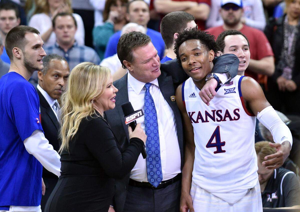Kansas Jayhawks coach Bill Self and tournament MVP Devonte’ Graham (4) are interviewed after the championship game of the Big 12 Tournament at Sprint (now T-Mobile) Center on March 12, 2016.