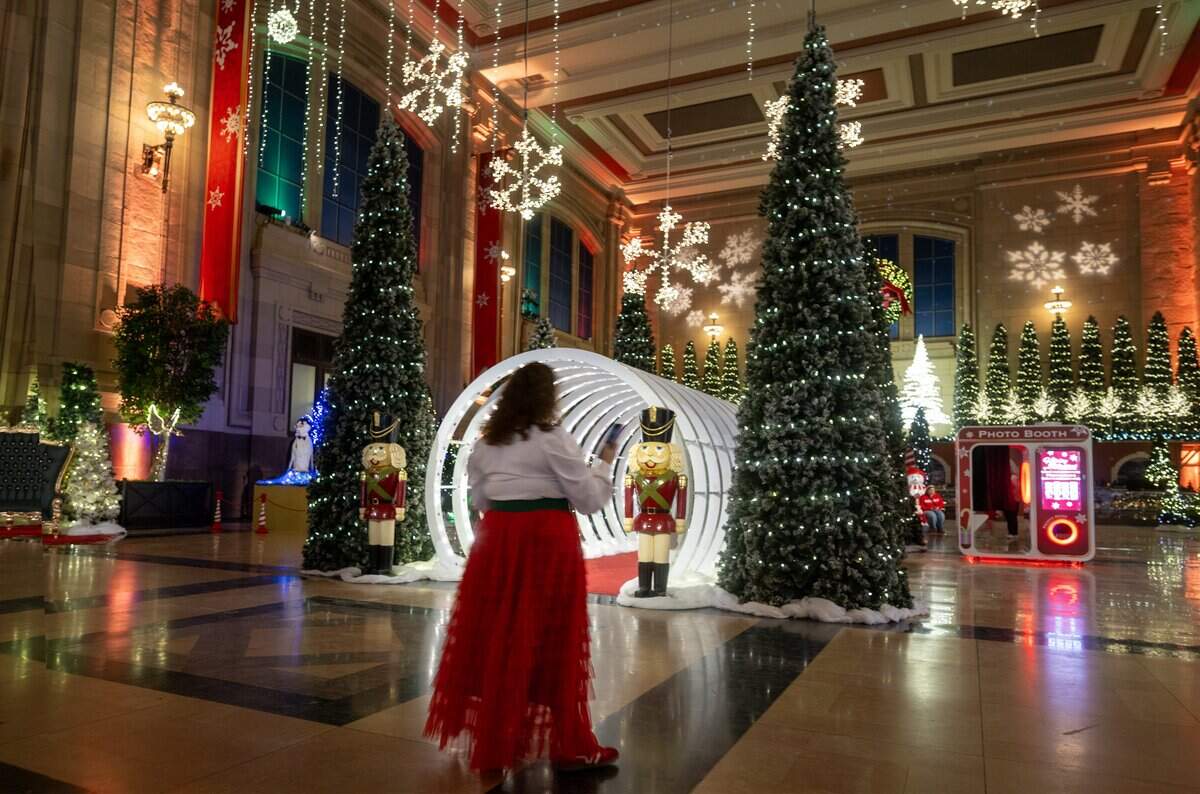 Andrea Eisenhower of Blue Springs captured the scene during a preview of “Holiday Reflections,” at Union Station on Thursday, November 20, 2025, in Kansas City.