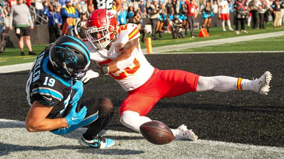 Carolina Panthers wide receiver Adam Thielen (19) can’t hold onto the ball defended by Kansas City Chiefs safety Justin Reid (20) who draws the personal foul during the second half at Bank of America Stadium.