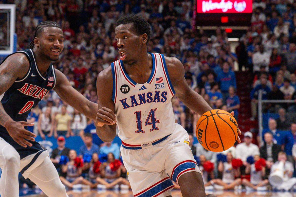 Kansas Jayhawks guard Melvin Council Jr. (14) drives into the paint in the second half vs. the Arizona Wildcats on Monday, February 9, 2026, at Allen Fieldhouse.