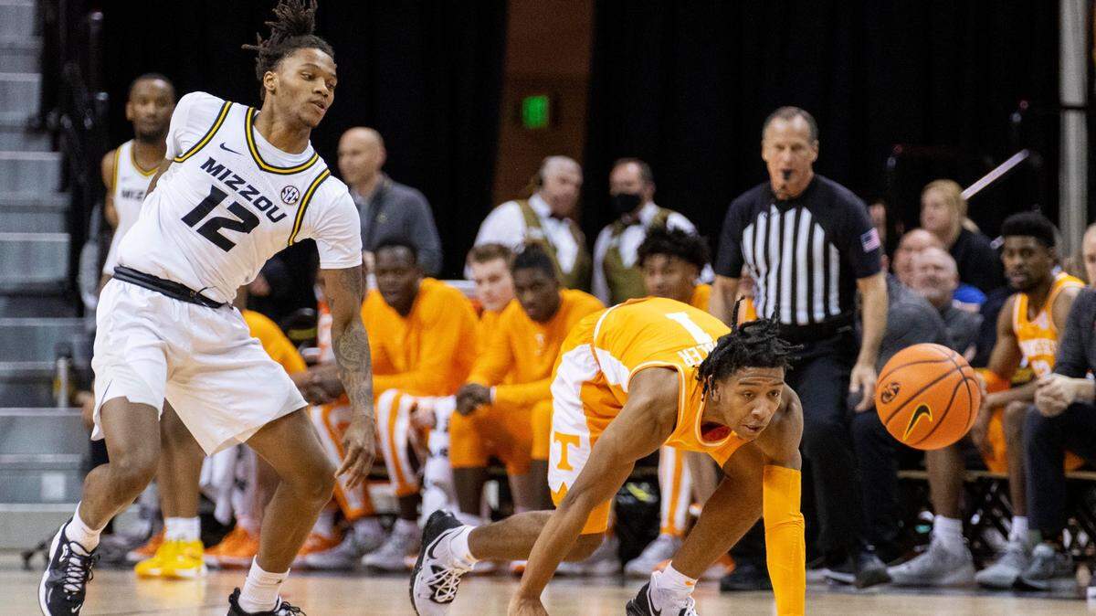 Tennessee’s Kennedy Chandler, right, and Missouri’s DaJuan Gordon, left, chase the ball during the first half of an NCAA college basketball game Tuesday, Feb. 22, 2022, in Columbia, Mo. (AP Photo/L.G. Patterson)