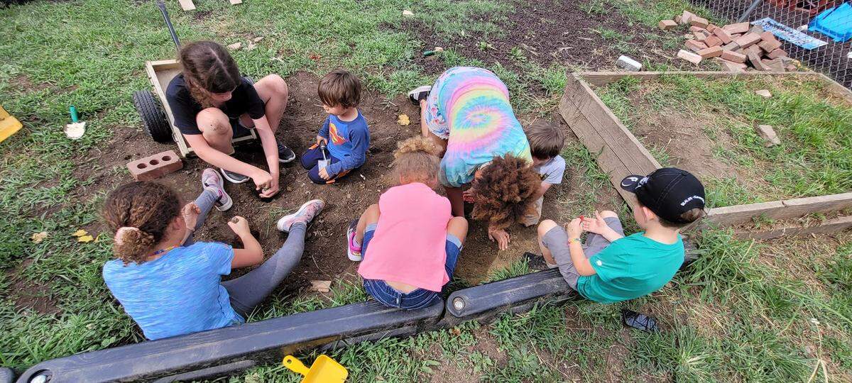 Students play outside at Calvary Lutheran Learning Center in Topeka. Like many in Kansas, the center’s director said she has a long waitlist.