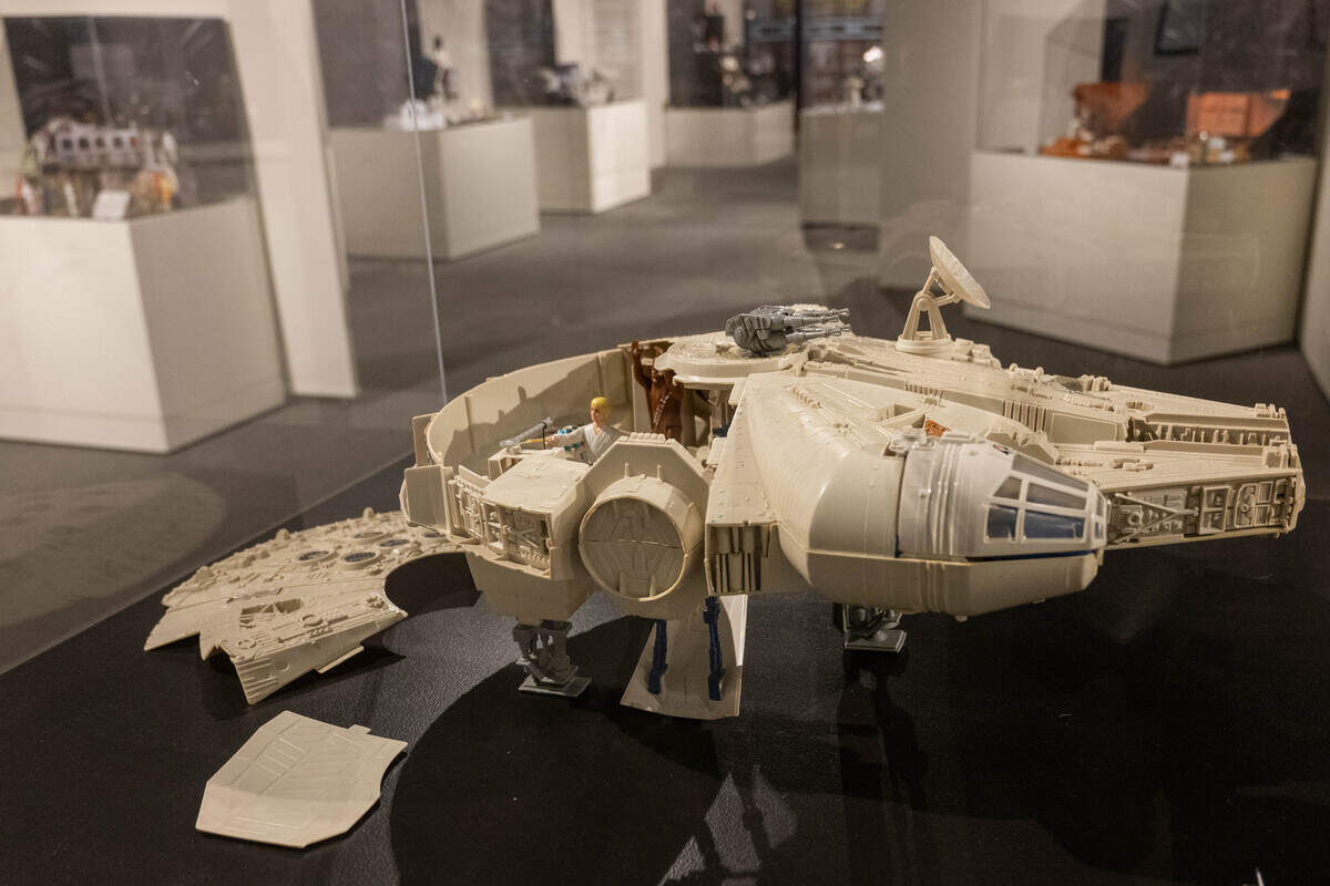 A vintage Millennium Falcon toy from is on display as part of the exhibit.