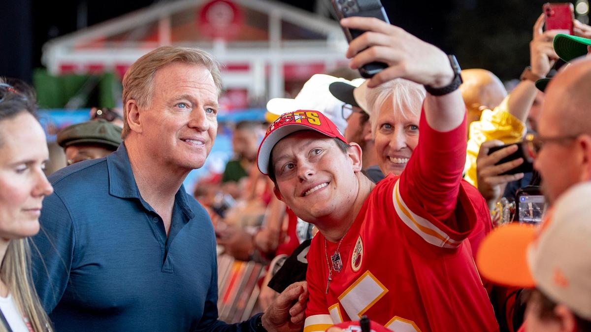 NFL Commissioner Roger Goodell takes a selfie with a Kansas City Chiefs fan during the sixth round of the NFL Draft outside of Union Station on Saturday, April 29, 2023, in Kansas City.
