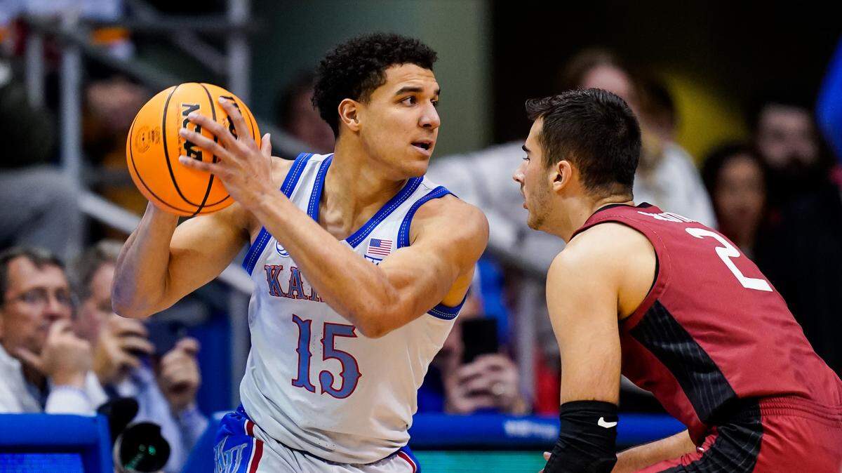Kansas Jayhawks guard Kevin McCullar Jr. (15) holds the ball during the first half against Harvard at Allen Fieldhouse on Dec. 22, 2022.