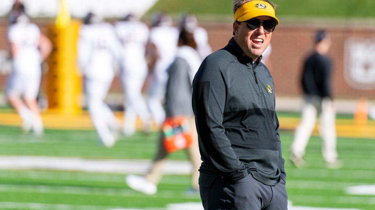 Mizzou football coach Eliah Drinkwitz watches his team warm up before the start of last weekend’s game against Texas A&M in Columbia, Mo.