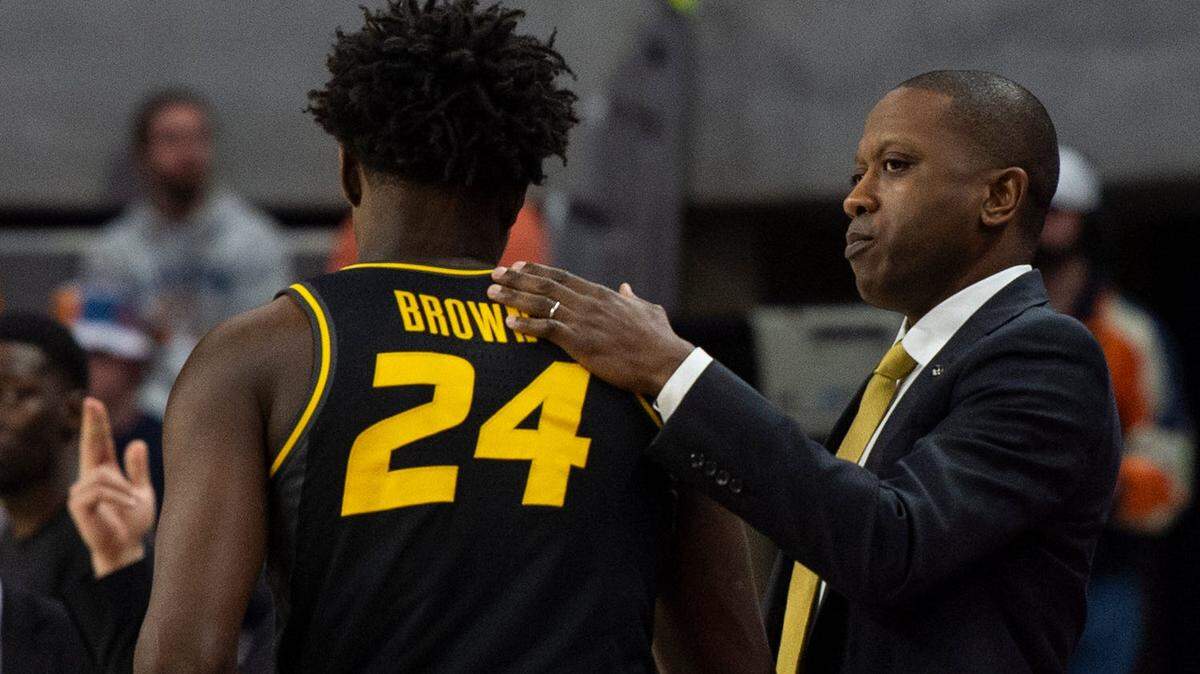 Missouri Tigers head coach Dennis Gates greets guard Kobe Brown (24) on the sideline as Auburn Tigers faced Mizzou at Neville Arena in Auburn, Ala., on Tuesday, Feb. 14, 2023.