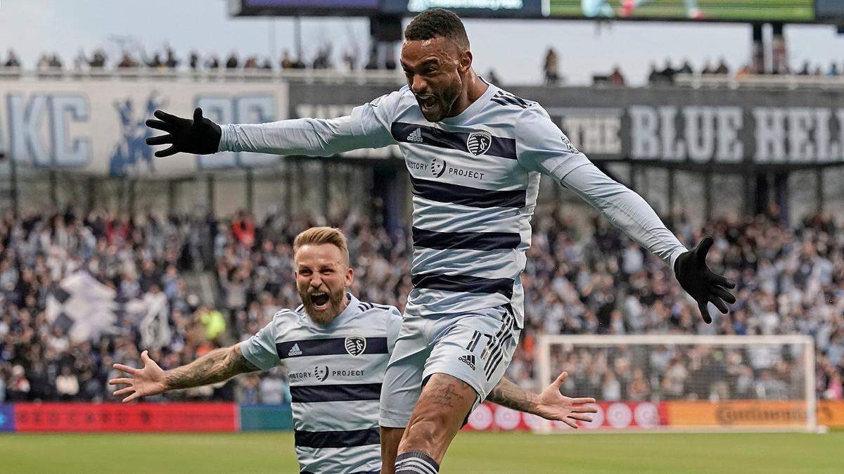 Sporting KC forward Khiry Shelton, front, and Sporting forward Johnny Russell celebrate after Shelton’s goal during last season’s MLS playoff opener against Vancouver at Children’s Mercy Park.