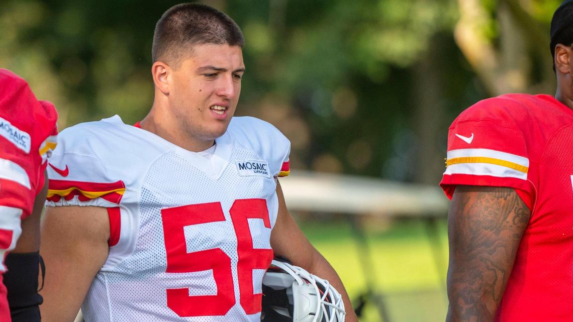 Kansas City Chiefs defensive end George Karlaftis (56) walks down to the field with other teammates for the first padded practice of Chiefs training camp on Monday, Aug. 1, 2022, in St. Joseph.