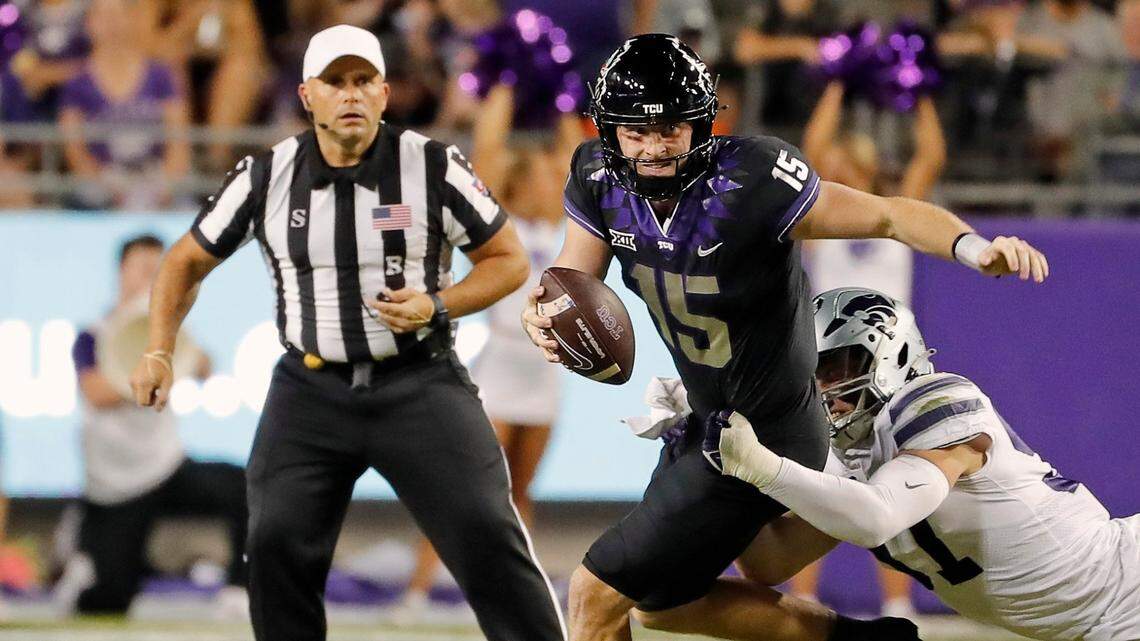 TCU quarterback Max Duggan is brought down by Kansas State defensive end Nate Matlack Saturday night at Amon G. Carter Stadium in Fort Worth, Texas.