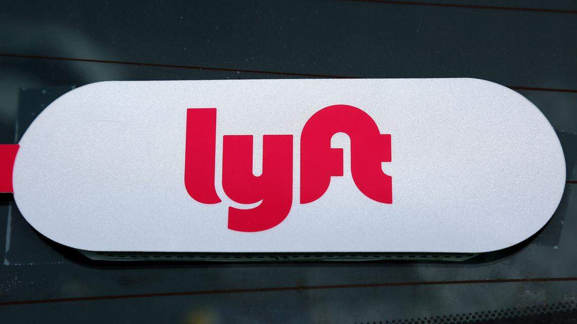 The woman stole the Lyft driver’s car, police say, then ran away after the vehicle was involved in a crash.