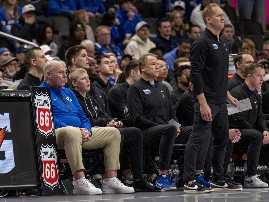 Chiefs Head Coach Andy Reid sat on the BYU bench as Coach Kevin Young watched during the second half of the Big 12 Men's Basketball Tournament at T-Mobile Center on Wednesday, March 11, 2026, in Kansas City.