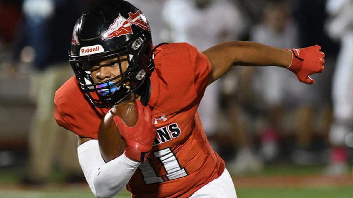 Fort Osage High’s Christen Penamon runs in the open field during the Indians 35-30 win over Oak Park Friday at Fort Osage.