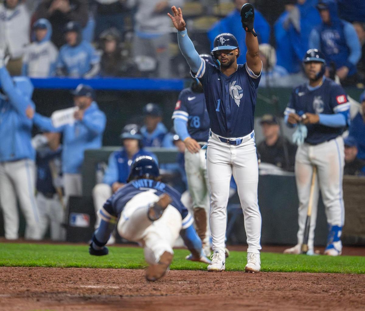 Kansas City Royals shortstop Bobby Witt Jr. (7) slides into home to score a run in the bottom of the eighth inning during an MLB game against the Baltimore Orioles on Friday, April 4, 2025, at Kauffman Stadium.