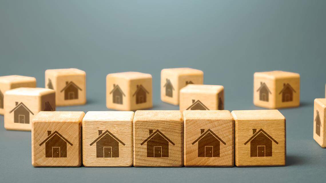 Row of wooden block houses. Rental business. Real estate investment. Purchase and resale of apartments. Realtor service. Buying or renting housing. Real estate market review and analysis. short-term rental airbnb vrbo home hotel