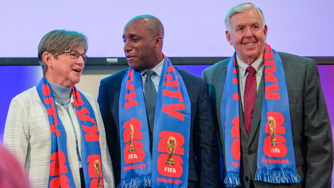 Kansas Governor Laura Kelly, left, Kansas City Mayor Quinton Lucas, and Missouri Governor Mike Parson pose for photos after a press conference regarding FIFA World Cup 2026 at GEHA Field at Arrowhead Stadium on Thursday, May 18, 2023, in Kansas City.
