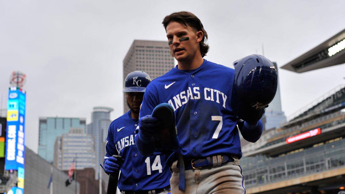 Kansas City Royals shortstop Bobby Witt Jr. (7) reacts after scoring a run as left fielder Edward Olivares (14) looks on during the first inning at Target Field on April 28, 2023.