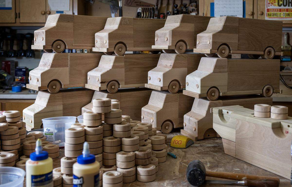 Since August, Jay Morris of JHM Woodworks and his volunteers have been transforming donated wood scraps into toy trucks, as seen on Tuesday, Dec. 2, 2025, in Lawrence, Kansas. Morris plans to donate all 115 handcrafted trucks to children in need through the Toys for Tots program.