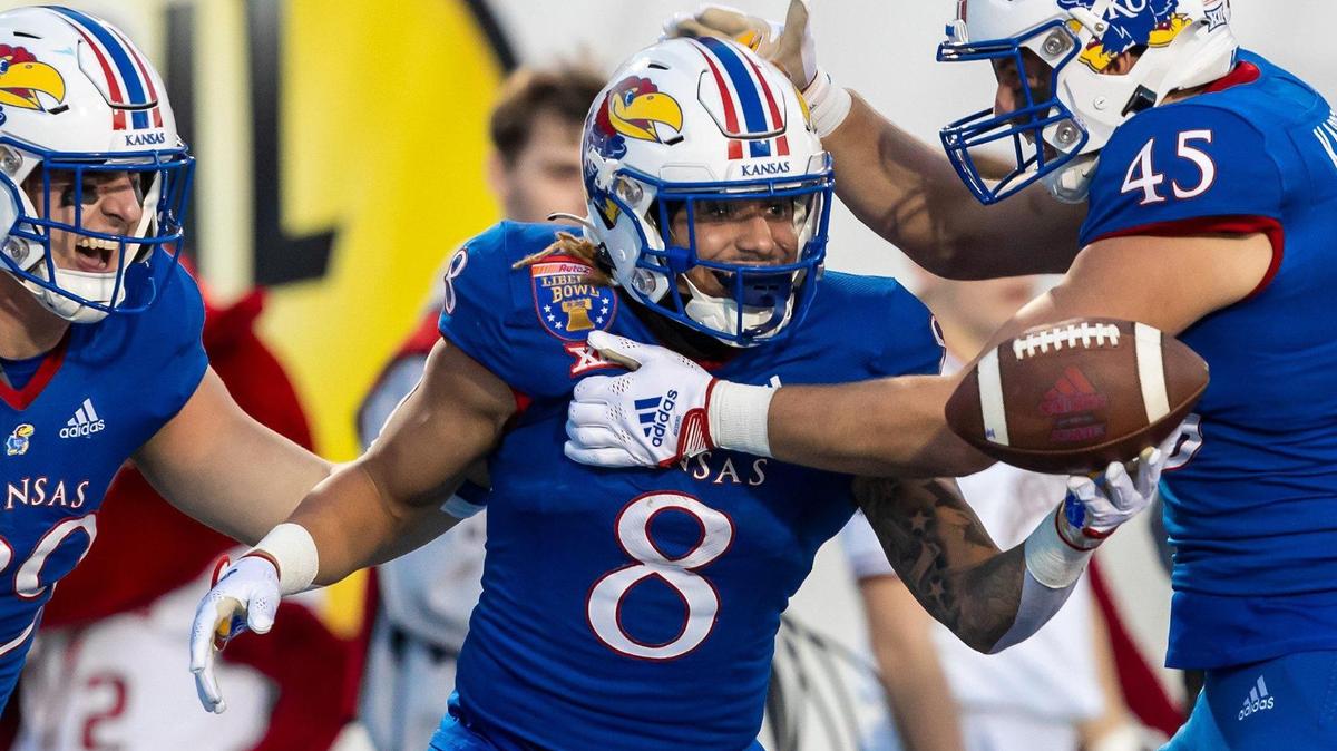 Kansas Jayhawks running back Ky Thomas (No. 8) celebrates after scoring a touchdown in the Liberty Bowl in Memphis, Tennessee.