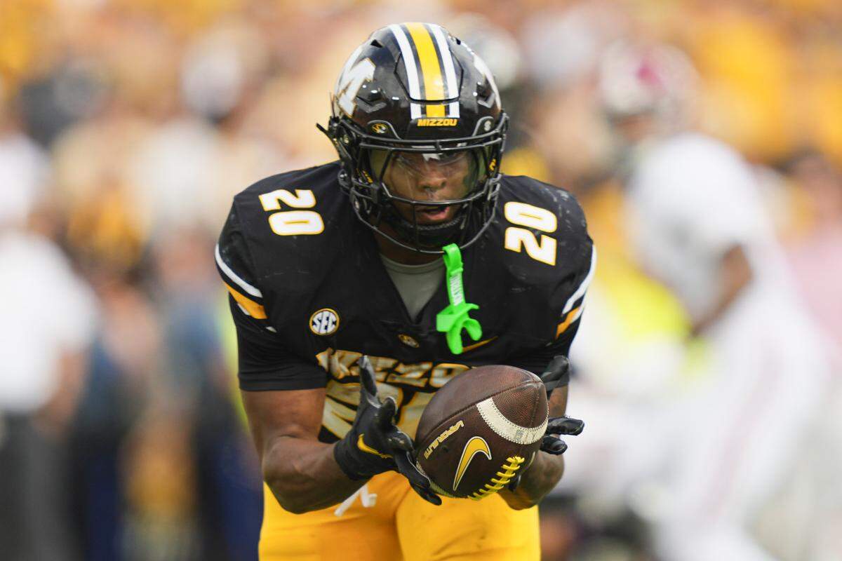 Missouri Tigers running back Jamal Roberts (20) makes a catch against the Alabama Crimson Tide during the second half of the game at Faurot Field at Memorial Stadium on Oct. 11, 2025.