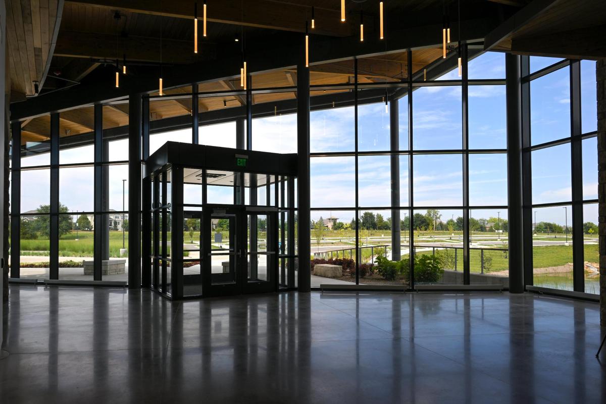 Open views to the features of the Overland Park Arboretum & Botnical Center are made possible by the floor to ceiling windows in the new visitor center.
