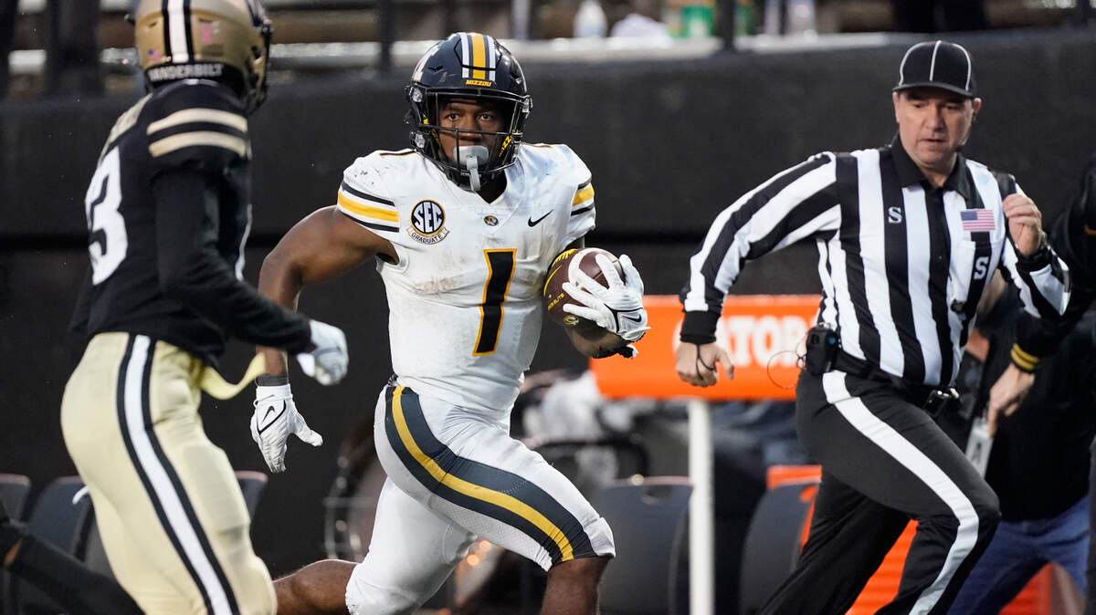 Missouri running back Tyler Badie (1) carries the ball for a 73-yard gain against Vanderbilt in the second half of an NCAA college football game Saturday, Oct. 30, 2021, in Nashville, Tenn. (AP Photo/Mark Humphrey)