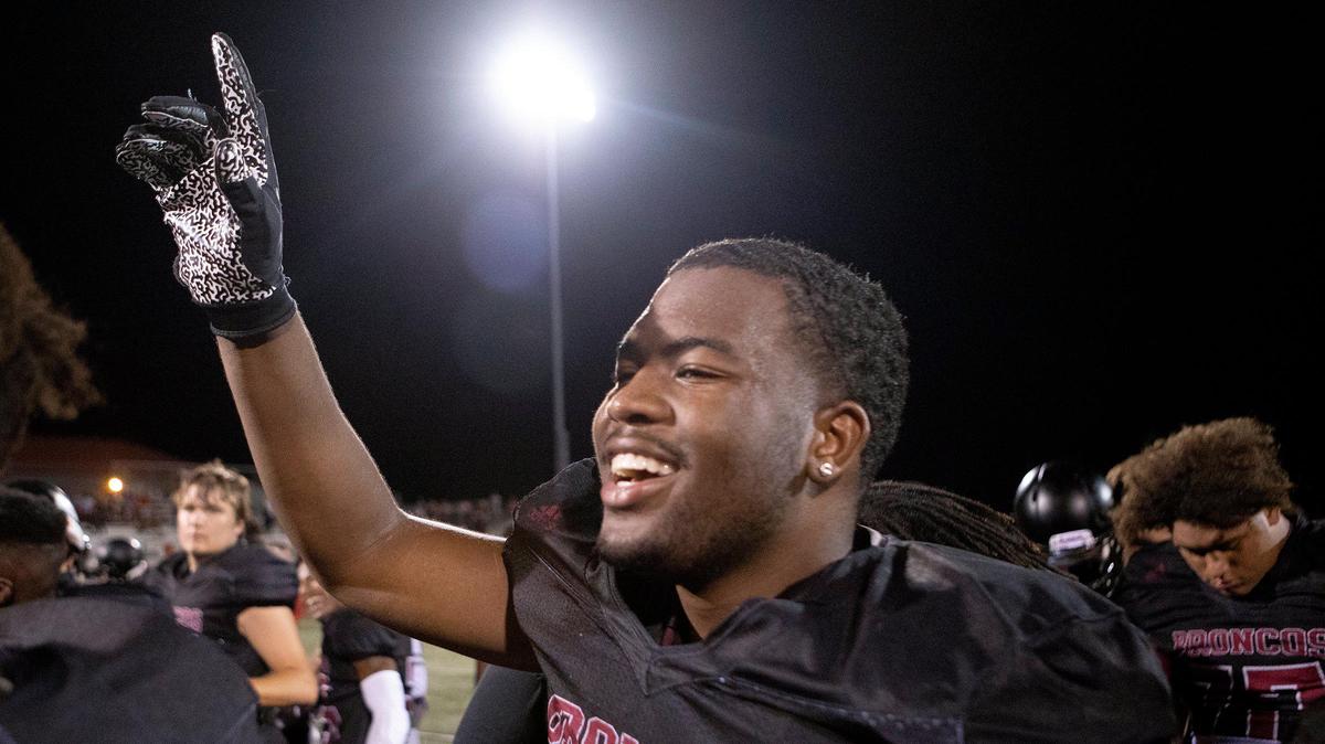 Lee’s Summit North’s Adrien Lock celebrated after the Broncos beat Blue Springs 31-21 on Friday night in Lee’s Summit.