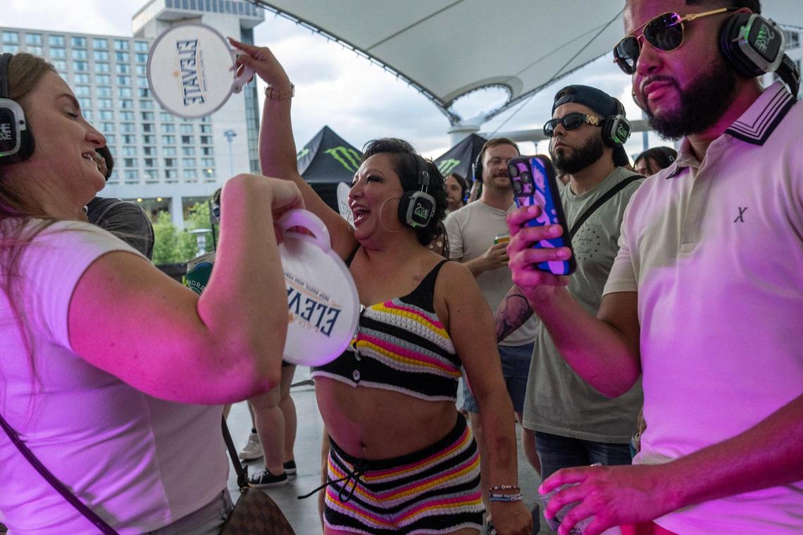 Virginia Mollinedo, center, dances at the Silent Disco Stage during Boulevardia on Saturday, June 14, in Kansas City.