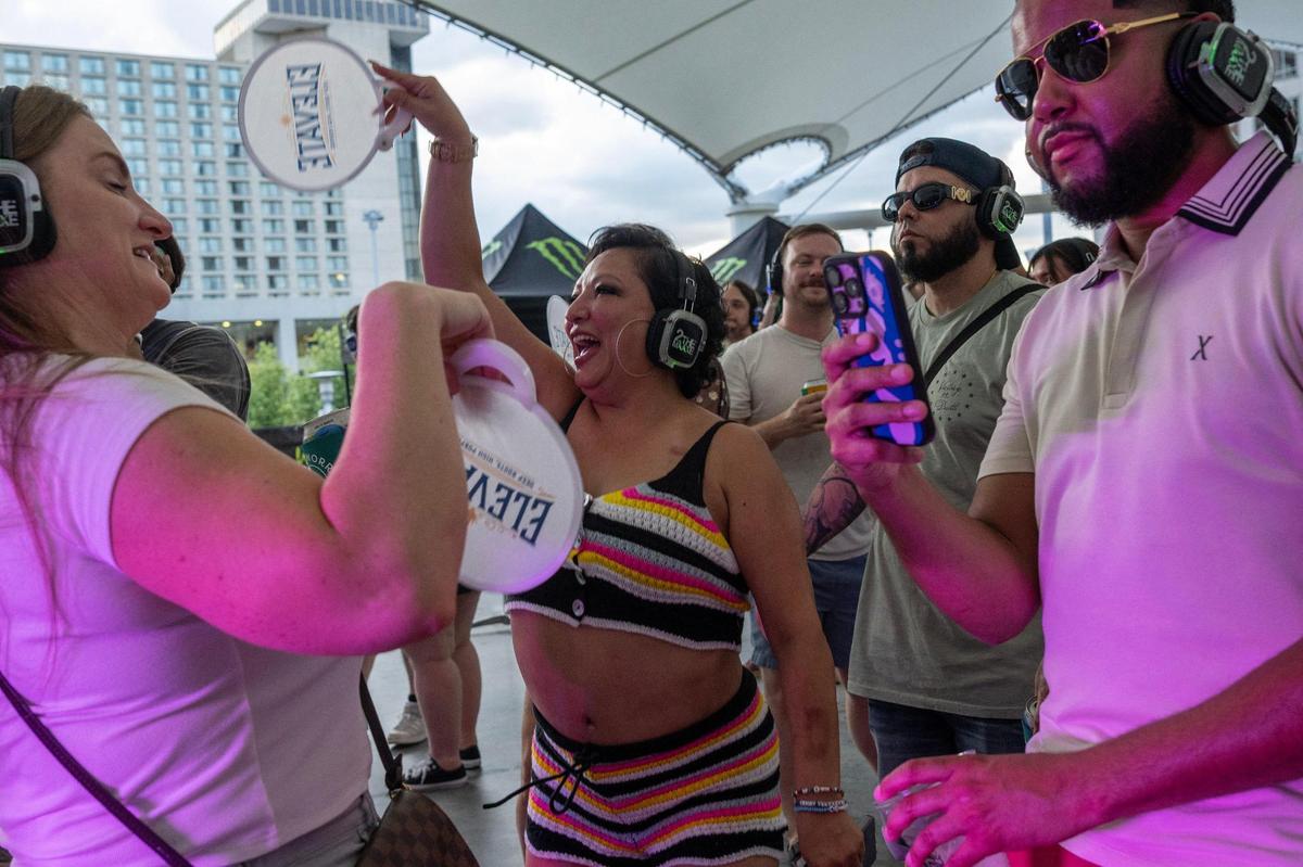 Virginia Mollinedo, center, dances at the Silent Disco Stage during Boulevardia on Saturday, June 14, 2025, in Kansas City.