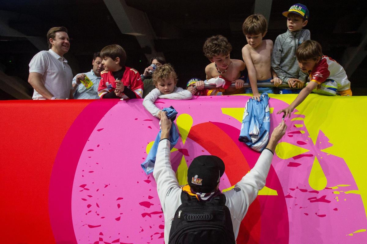 Philadelphia Eagles players sign autographs during opening night of the Super Bowl at Caesars Superdome in New Orleans on Monday, Feb. 3, 2025.