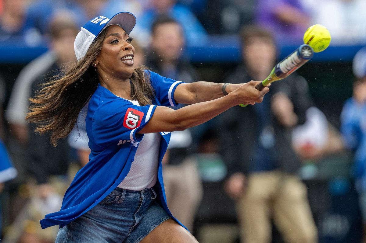 Actress Ego Nwodium takes a swing during the Big Slick celebrity softball game at Kauffman Stadium on Friday, May 31, 2024, in Kansas City.