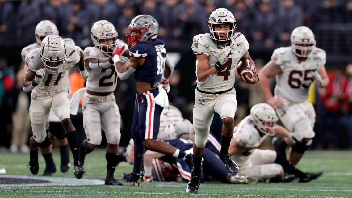 Army quarterback Christian Anderson (4) runs for a touchdown against Navy during the first half of an NCAA college football game Saturday, Dec. 11, 2021, in East Rutherford, N.J. (AP Photo/Adam Hunger)