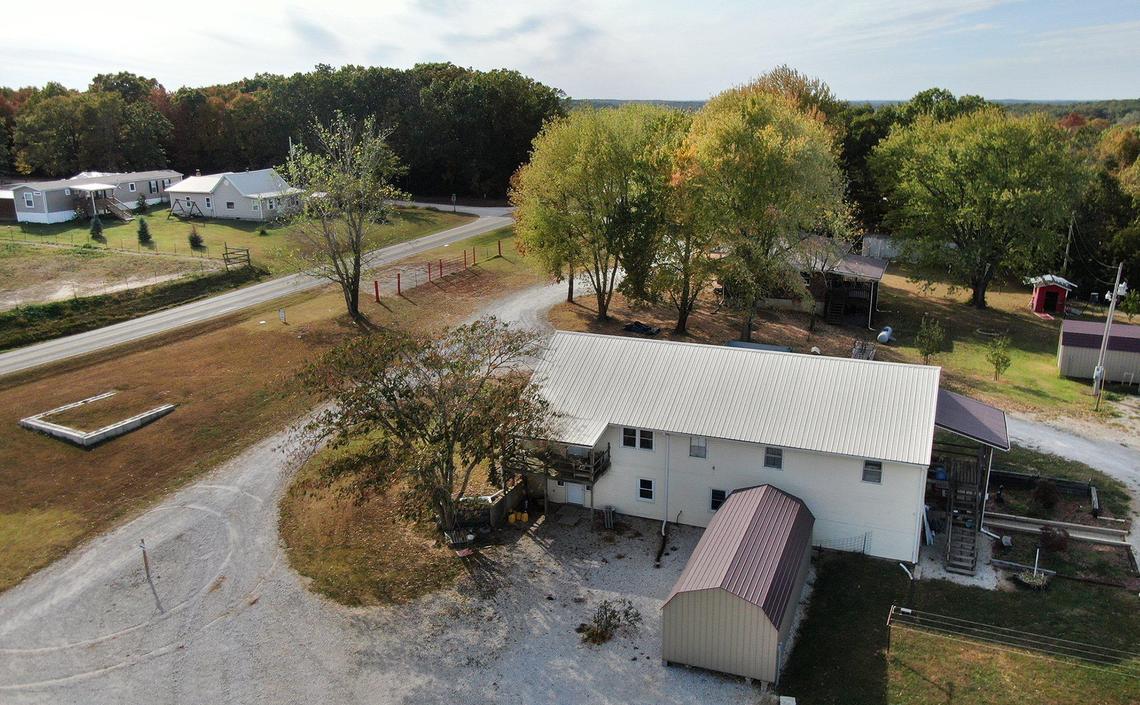 The now-closed Circle of Hope Girls’ Ranch, which sits on 35 acres in southwest Missouri, is listed for sale. The listing features two residential properties, one on each side of the road.