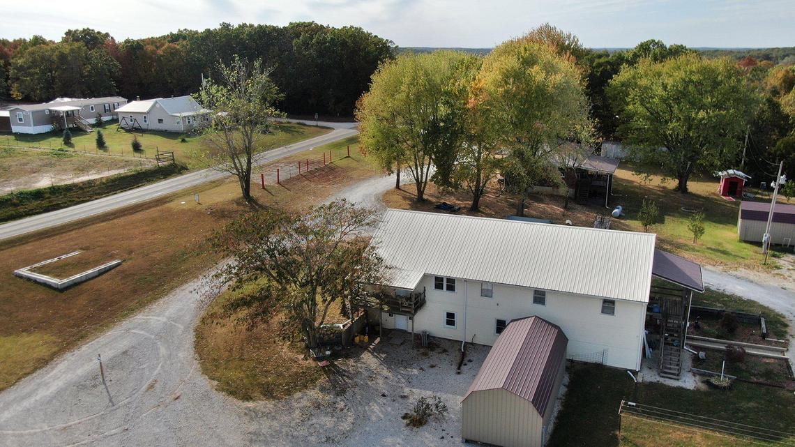 The now-closed Circle of Hope Girls Ranch, which sits on 35 acres in southwest Missouri, is listed for sale. The listing features two residential properties, one on each side of the road.