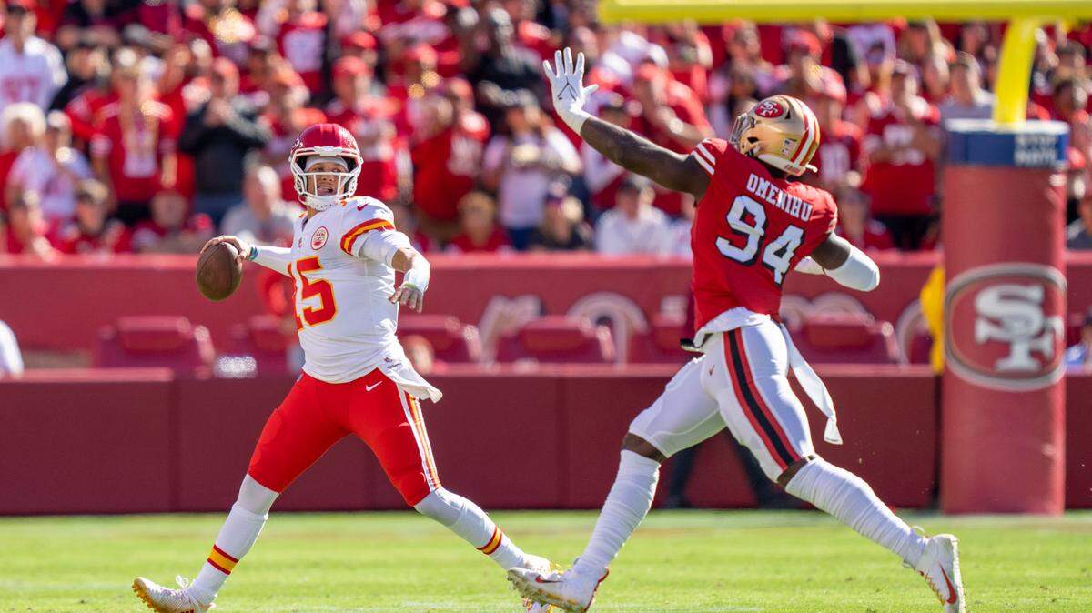October 23, 2022; Santa Clara, California, USA; Kansas City Chiefs quarterback Patrick Mahomes (15) passes the football against San Francisco 49ers defensive end Charles Omenihu (94) during the second quarter at Levi’s Stadium. Mandatory Credit: Kyle Terada-USA TODAY Sports