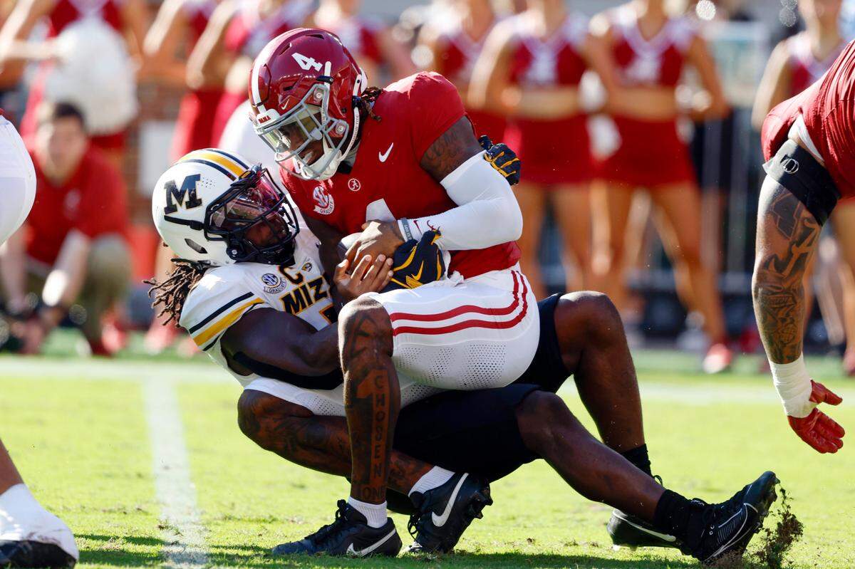Missouri Tigers defensive end Johnny Walker Jr. sacks Alabama Crimson Tide quarterback Jalen Milroe during Saturday’s game at Bryant-Denny Stadium.