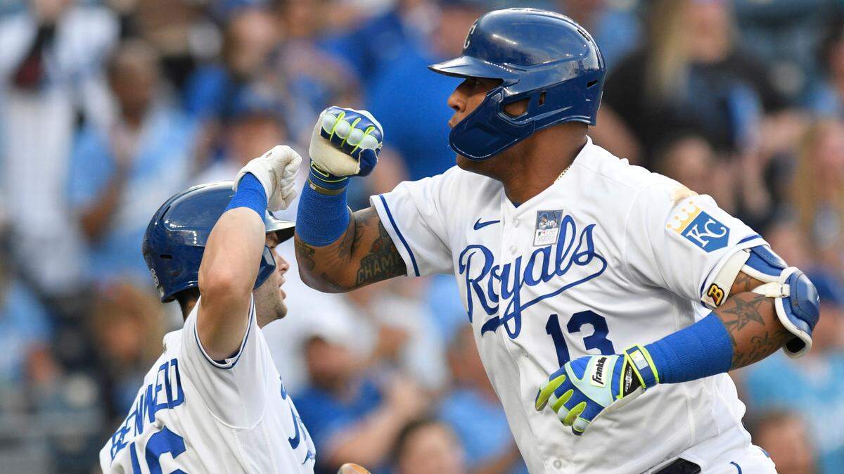 Kansas City Royals’ Salvador Perez (13) celebrates his solo home run against the Minnesota Twins with Andrew Benintendi (16) during the first inning of a baseball game Thursday, June 3, 2021, in Kansas City, Mo. (AP Photo/Reed Hoffmann)