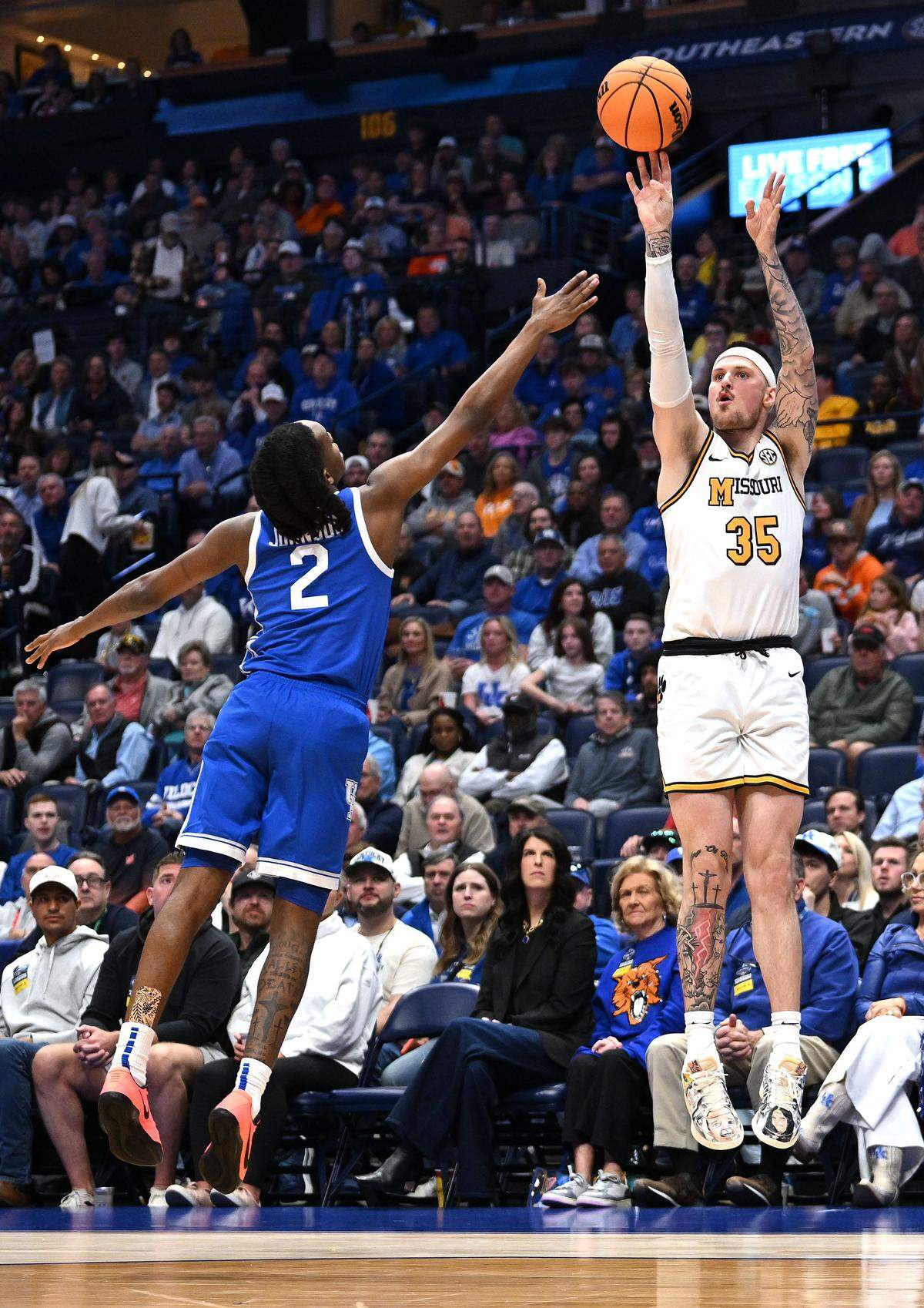 NASHVILLE, TENNESSEE - MARCH 12: Jacob Crews #35 of the Missouri Tigers shoots a three point basket against Jasper Johnson #2 of the Kentucky Wildcats during the first half in the second round of the 2026 SEC Men's Basketball Tournament at Bridgestone Arena on March 12, 2026 in Nashville, Tennessee. (Photo by Carly Mackler/Getty Images)