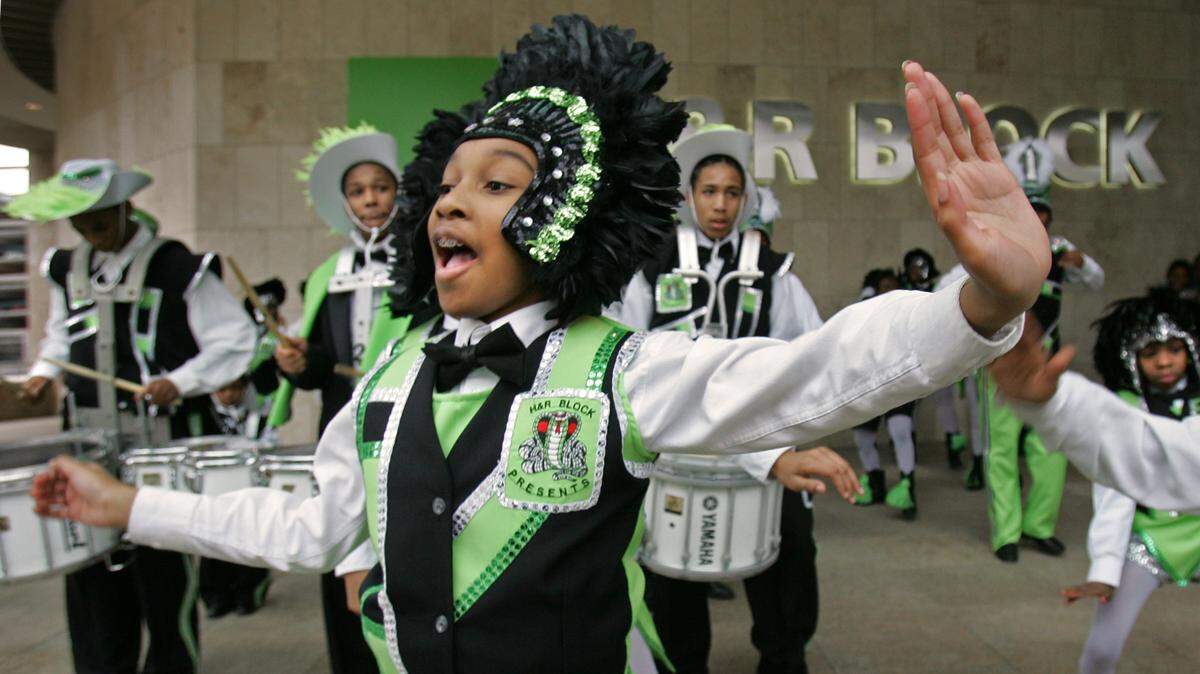 The Marching Cobras helped H&R Block celebrated their National Tax Advice Day in 2007 at the company’s headquarters at Main and 13th Street.