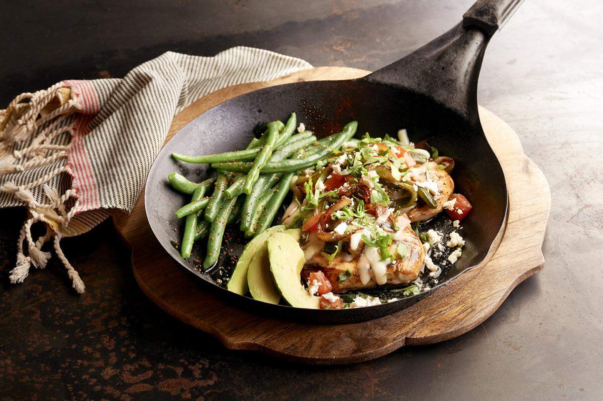 Saltgrass Steakhouse’s Chicken Laredo with Jack and feta cheese, avocado, grilled onions, tomatoes, poblano peppers and cilantro.