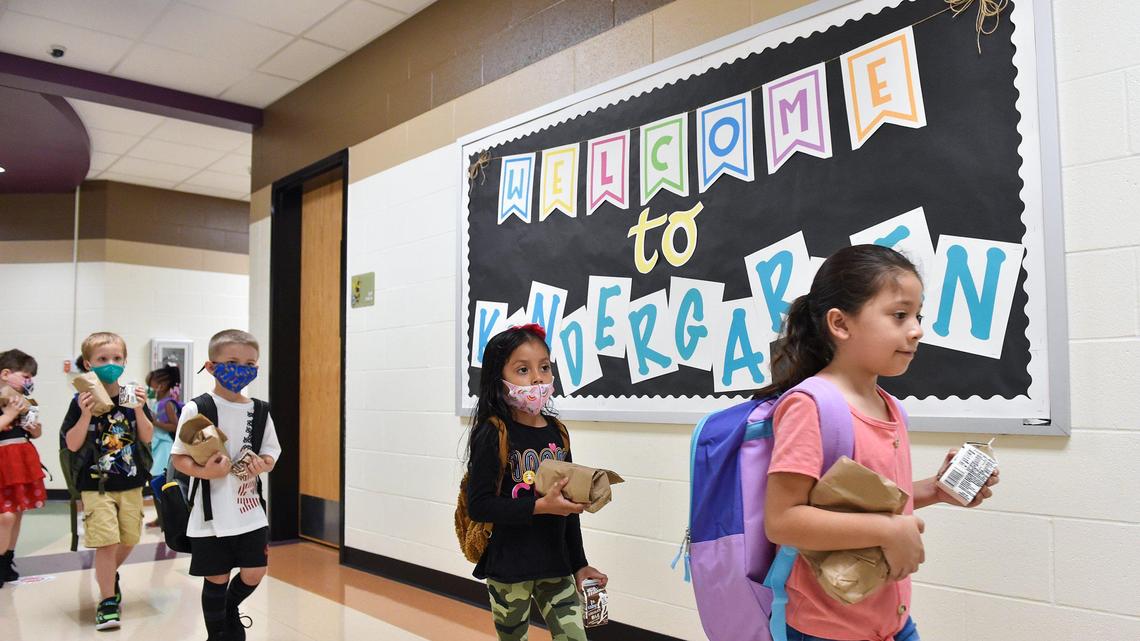 Students head to their classroom for the first day of school at Hazel Grove Elementary in Kansas City, Kansas on Aug. 11.